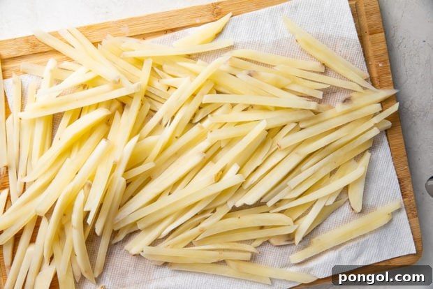 Step 1: Cutting potatoes into sticks.