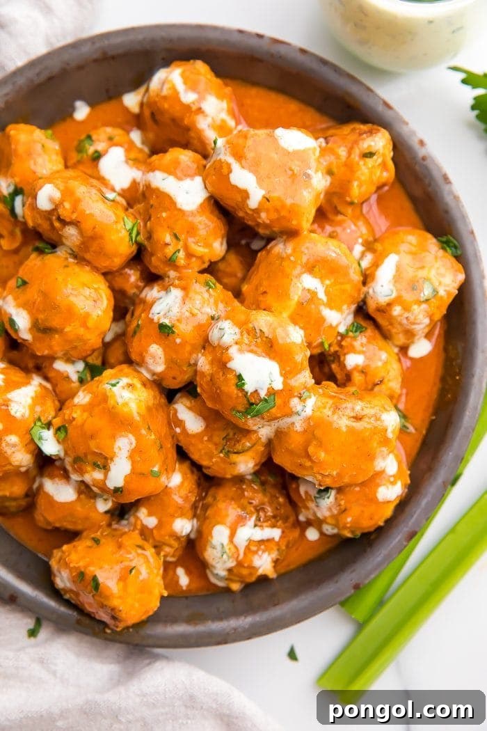 Buffalo Chicken Meatballs served in a bowl with ranch dressing
