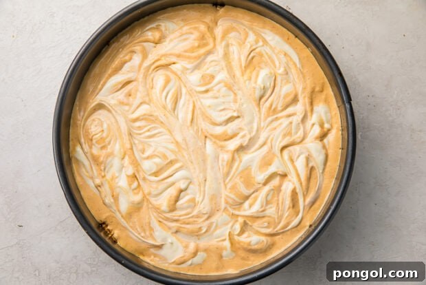 Swirling cheesecake batter for marbled effect before baking