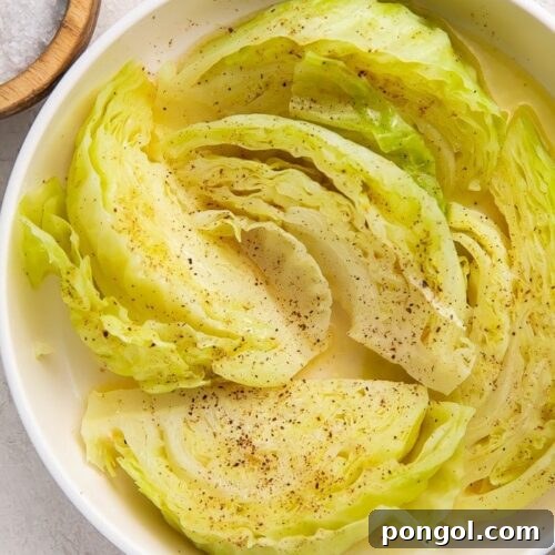 Boiled cabbage in a white bowl, served as a side dish
