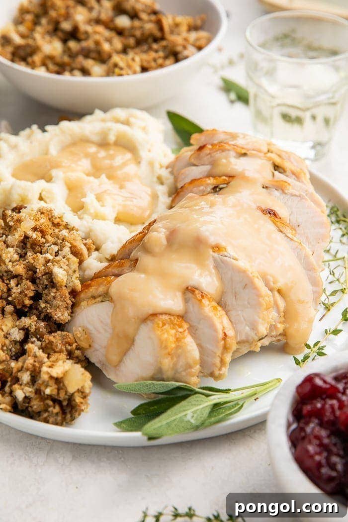 Delicious Instant Pot Turkey Breast 3 Close-up of perfectly sliced Instant Pot turkey breast, glistening with gravy, showcasing its incredible tenderness and succulence.