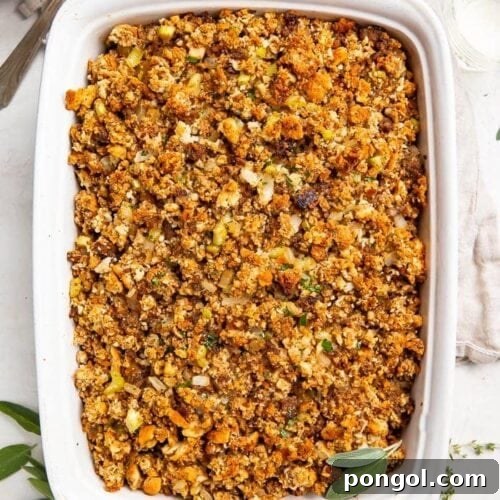 Heirloom Sausage Stuffing 5 Overhead photo of a white casserole dish with Thanksgiving sausage stuffing, golden brown and ready to serve.