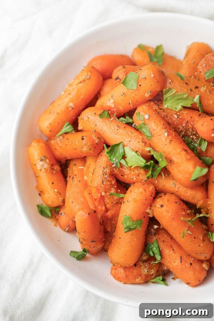 Stress-Free Thanksgiving: 19 Instant Pot Dishes 15 A bowl of perfectly steamed Instant Pot carrots, glistening with a light glaze or butter, ready to be served as a healthy and flavorful side dish.
