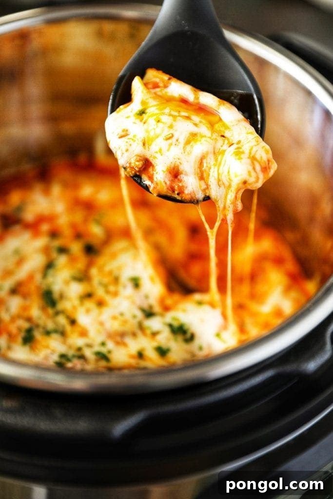 Stress-Free Thanksgiving: 19 Instant Pot Dishes 21 A close-up of baked Instant Pot stuffed shells, generously filled with ricotta and spinach, topped with marinara sauce and melted cheese, served in a casserole dish.