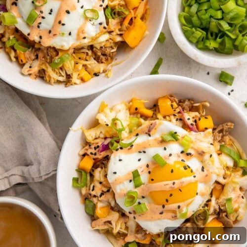 Breakfast Egg Roll in a Bowl with a fried egg and creamy chili sauce