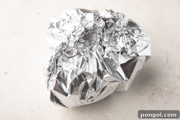 Whole beets wrapped in aluminum foil pouch