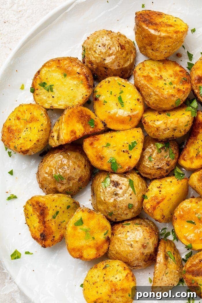 Roasted potatoes on a white platter