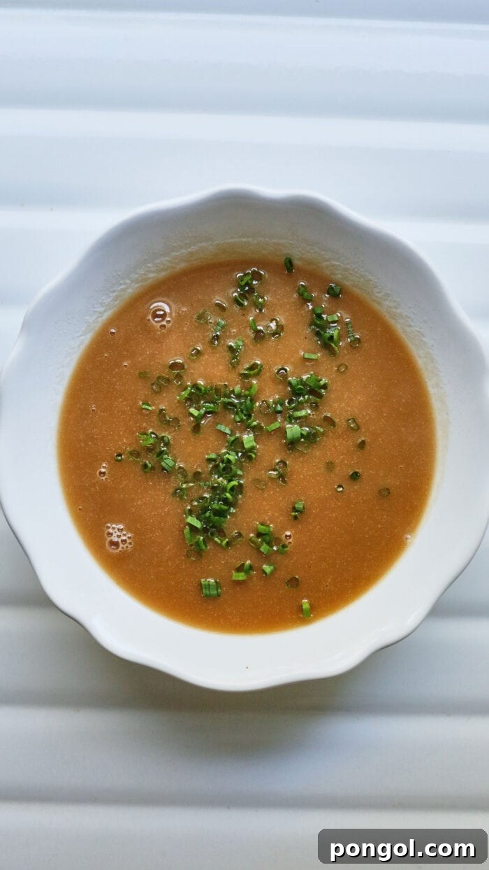 White bowl with hard cider gravy for Thanksgiving recipes