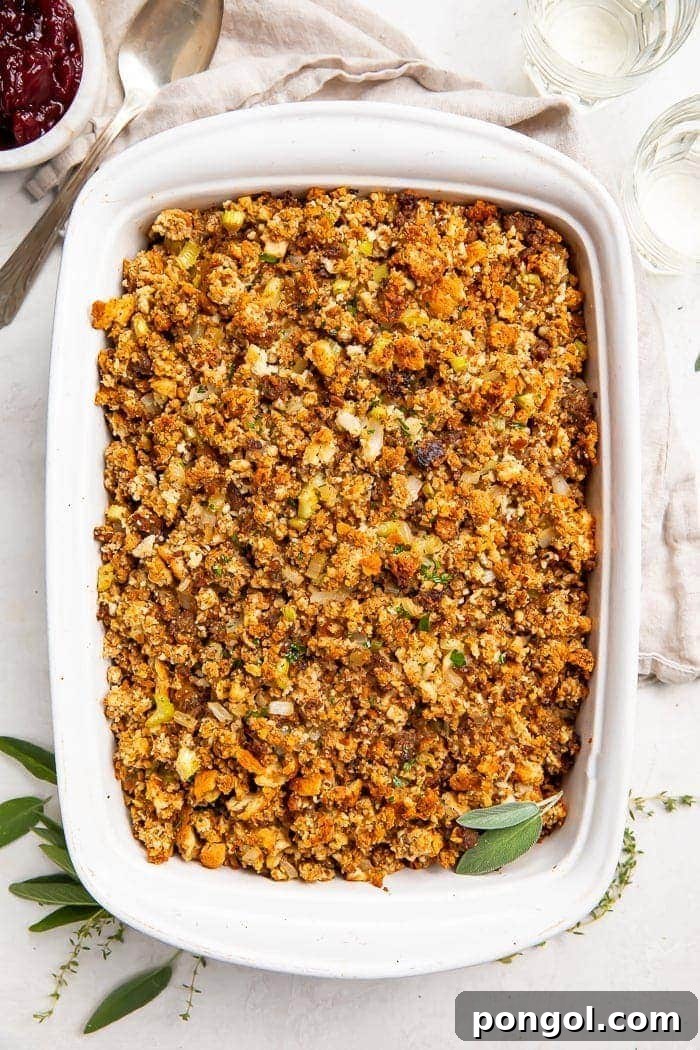 Overhead photo of a white casserole dish with Thanksgiving sausage stuffing