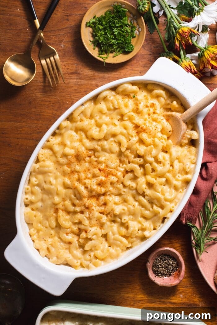 Gouda mac and cheese casserole in a white dish on a Thanksgiving table