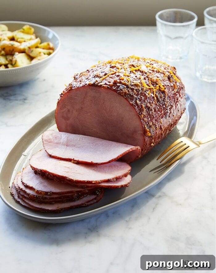 Sliced whole ham on a platter