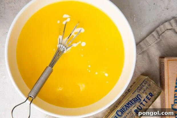 Quick Microwave Hollandaise 4 Egg yolks and melted butter being combined with cream and lemon juice