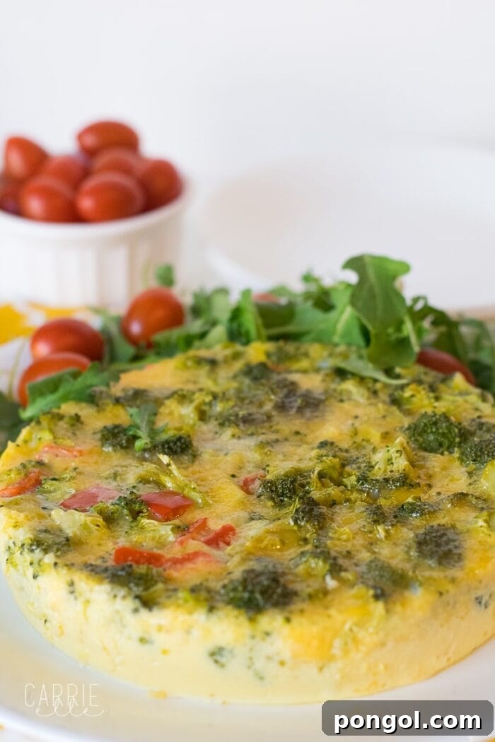 Vegetarian Instant Pot quiche in the foreground with a ramekin of cherry tomatoes in the background