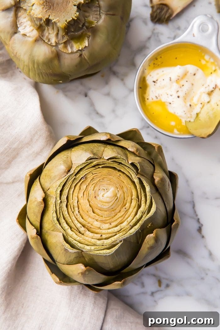 An instant pot artichoke on a marble work surface