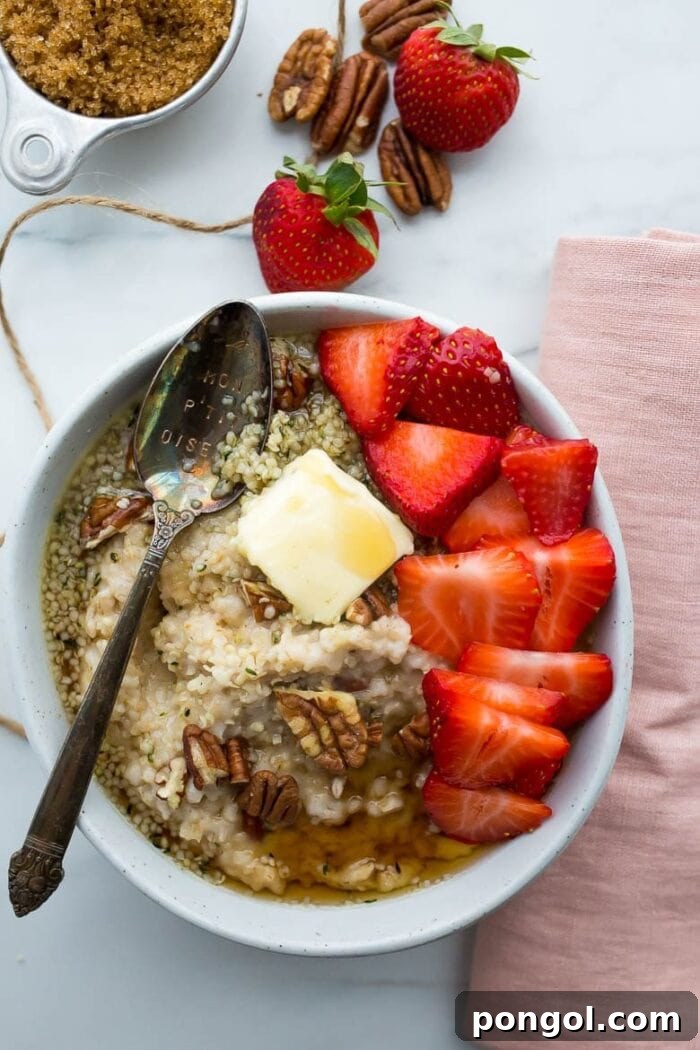 Oatmeal with pecans, butter, and strawberries