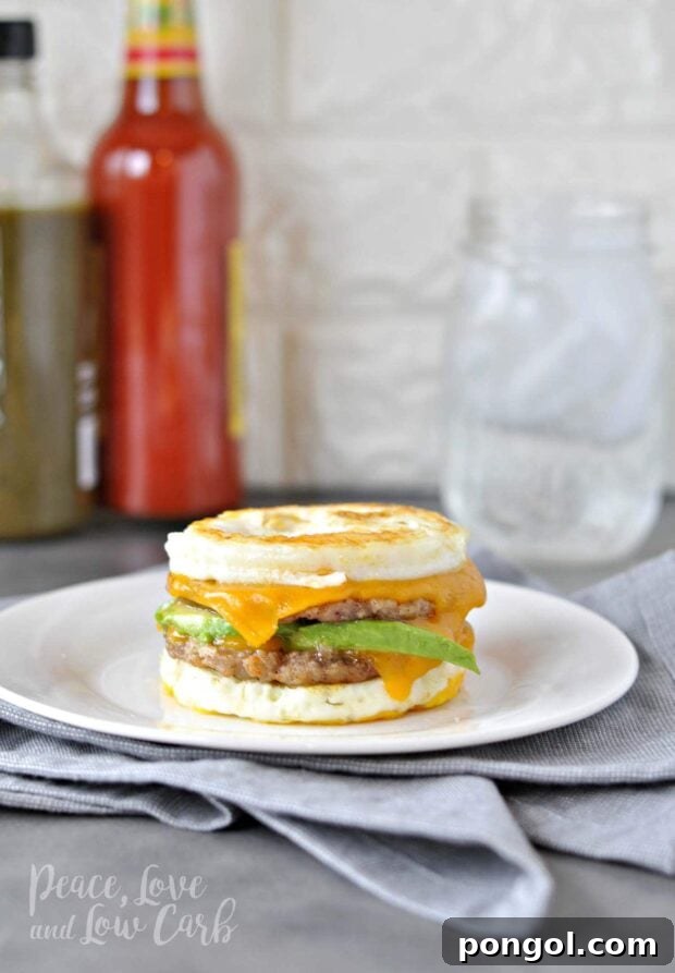 Delicious Keto breakfast sandwich with a juicy sausage patty, fried egg, and melted cheese.