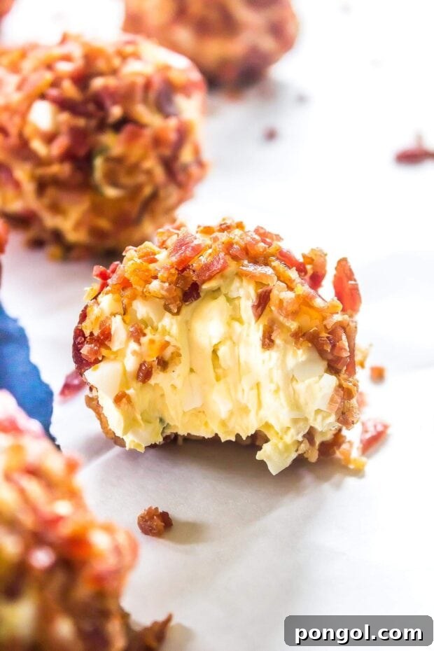 Cream cheese and bacon Keto Breakfast Fat Bombs arranged on a plate.