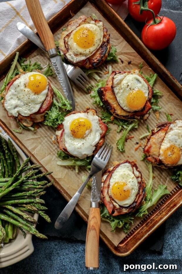 Elegant Low Carb Croque Madame served on a sheet pan with garnish and silverware.