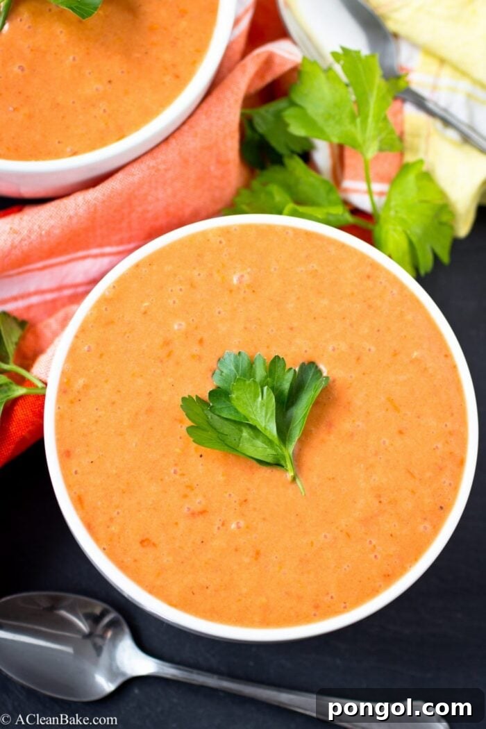 New Year, New You: 65 Satisfying Whole30 Meals 12 A beautifully garnished bowl of creamy tomato soup with fresh parsley.