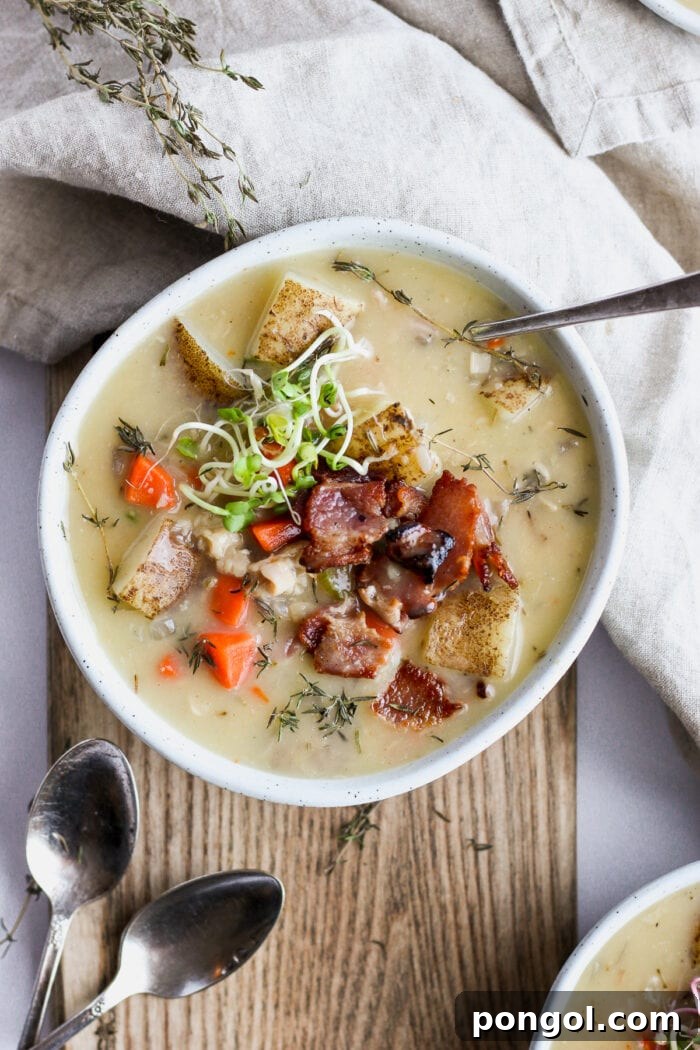 New Year, New You: 65 Satisfying Whole30 Meals 15 A uniquely shaped bowl of creamy clam chowder, beautifully garnished.