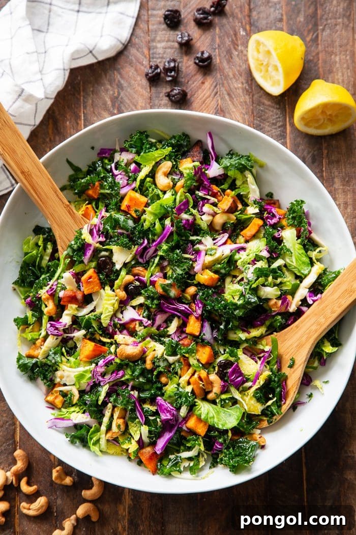 New Year, New You: 65 Satisfying Whole30 Meals 18 A vibrant rainbow veggie salad in a skillet, served with two wooden spoons.