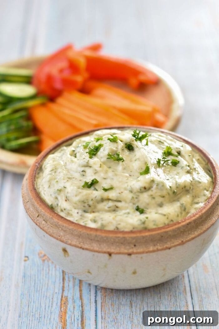 New Year, New You: 65 Satisfying Whole30 Meals 27 A neutral bowl of Whole30 dill veggie dip, surrounded by an assortment of fresh vegetables.