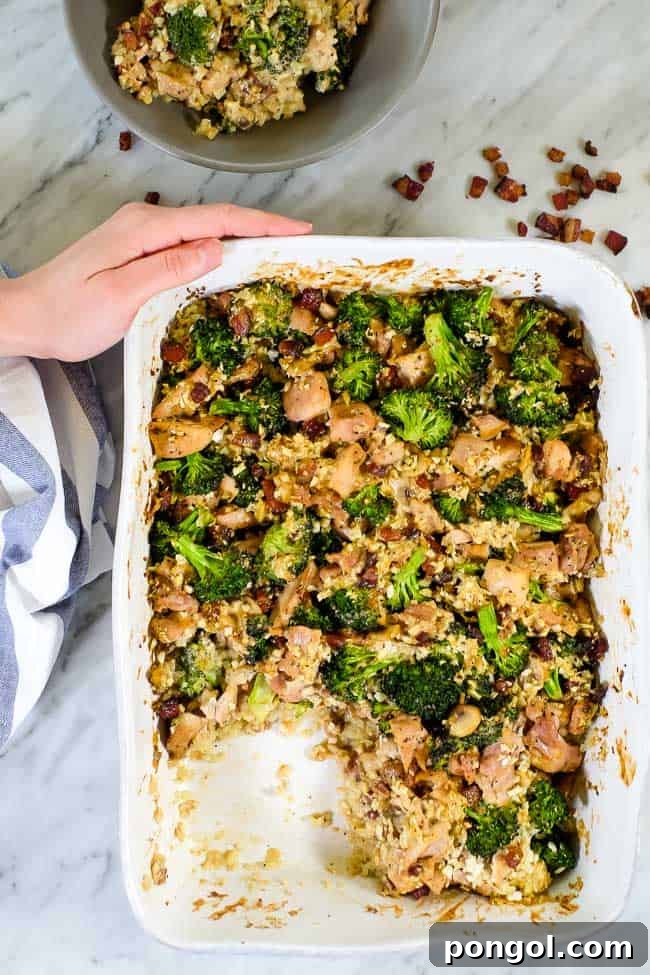 New Year, New You: 65 Satisfying Whole30 Meals 33 A baking dish filled with a creamy broccoli and chicken casserole, with one serving removed.