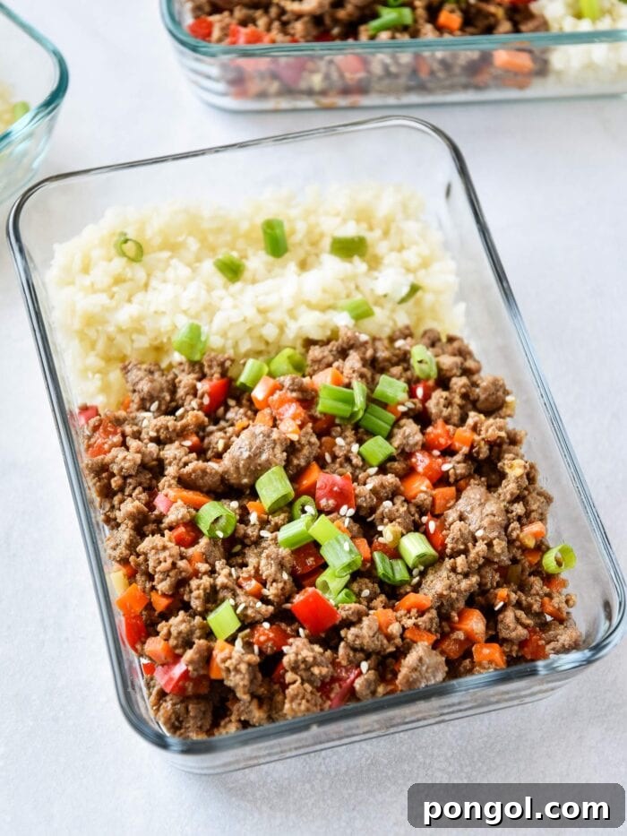 New Year, New You: 65 Satisfying Whole30 Meals 60 A glass meal prep container with cauliflower rice, assorted veggies, and flavorful ginger ground beef.