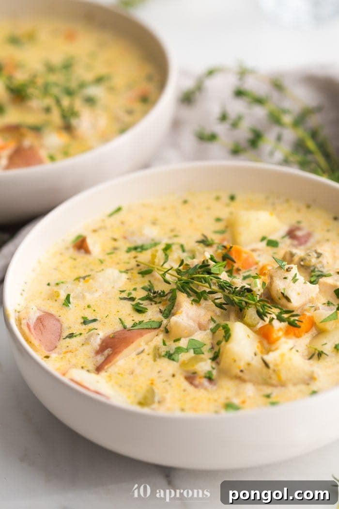 New Year, New You: 65 Satisfying Whole30 Meals 10 Pot pie soup served in elegant white bowls, offering a comforting and satisfying meal.