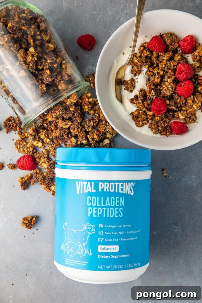 Vital Proteins collagen peptides container next to a glass jar of spilled granola and a bowl of keto granola on top of yogurt with raspberries, emphasizing its appeal as a healthy, versatile food
