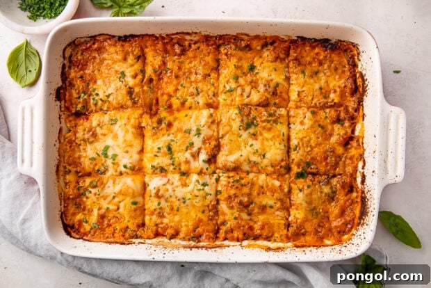 The Keto Lasagna Revelation 14 Baked keto lasagna neatly sliced into 12 perfect portions within the baking dish.