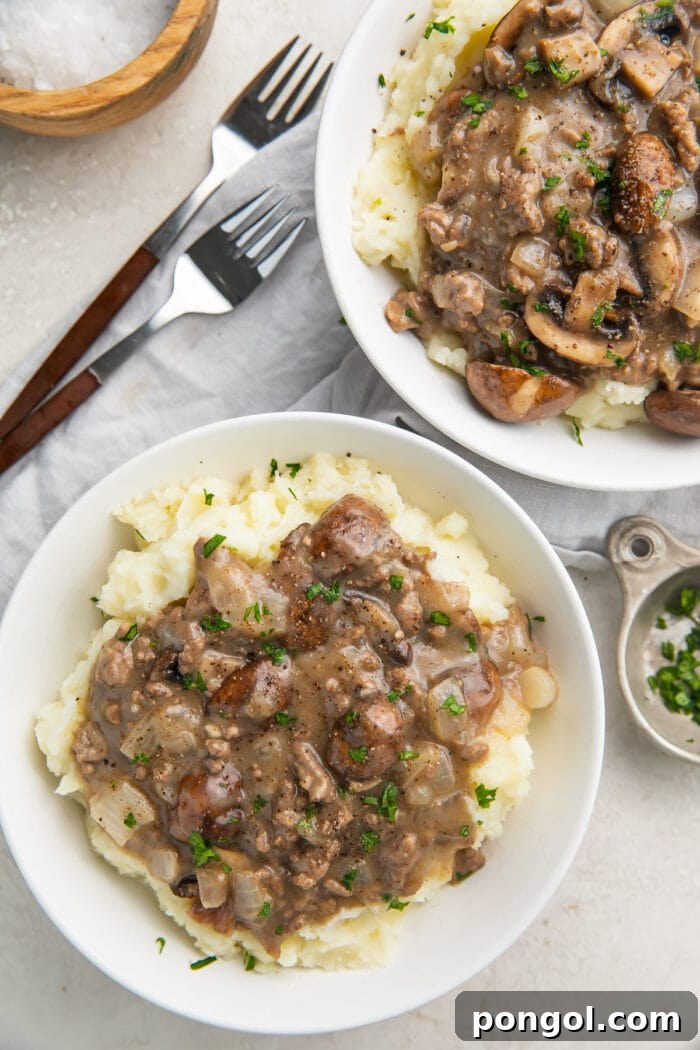 Overhead photo of plated whole30 beef stroganoff on top of mashed potatoes