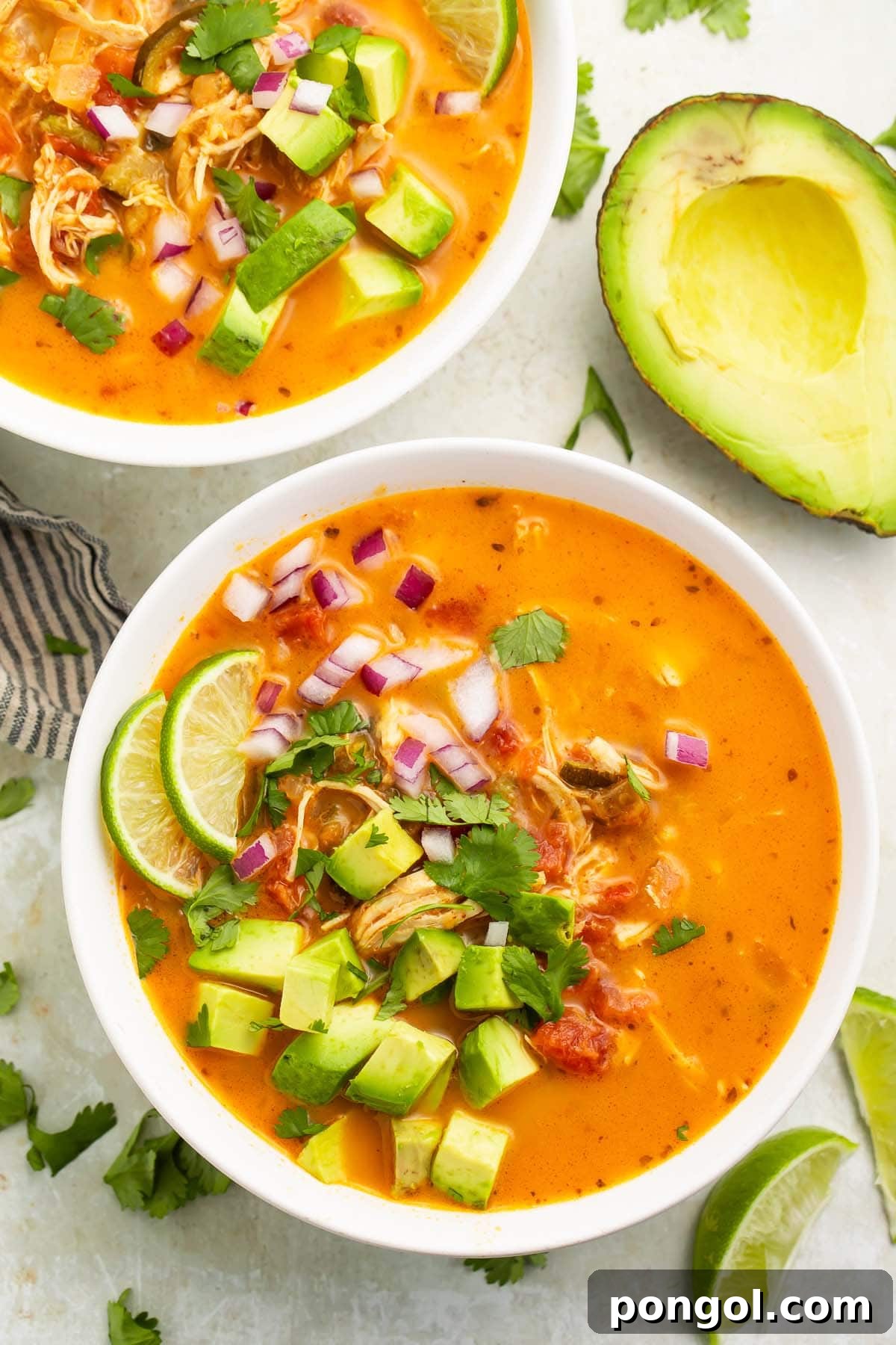 A large white bowl of Whole30 chicken tortilla-less soup on a table.