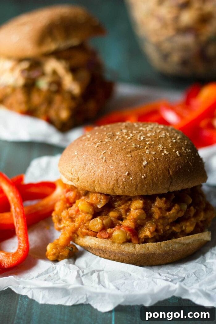 A plate of hearty vegan sloppy joes, served with a side of crispy bell pepper fries, creating a colorful and satisfying meal.