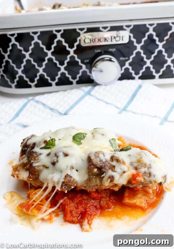 Low carb meatball casserole in front of a patterned slow cooker