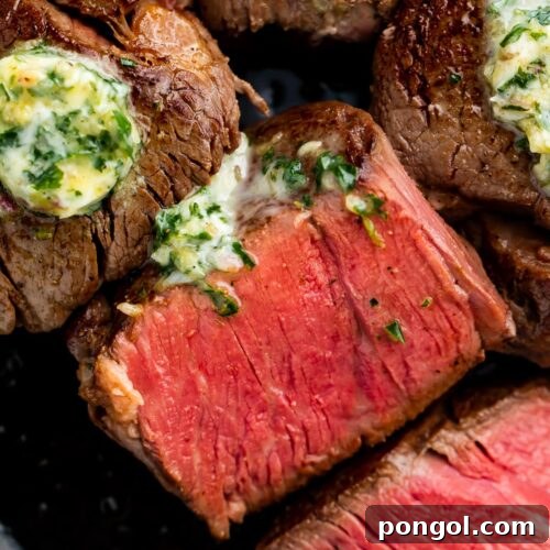 Cut sous vide filet mignon in cast iron skillet