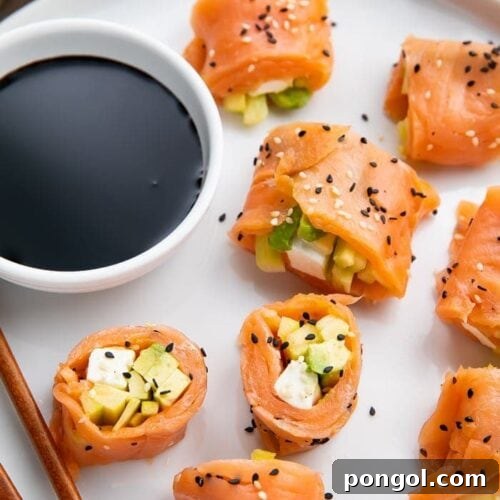 Close-up of a perfectly rolled keto smoked salmon sushi log, ready for slicing, showing the internal layers