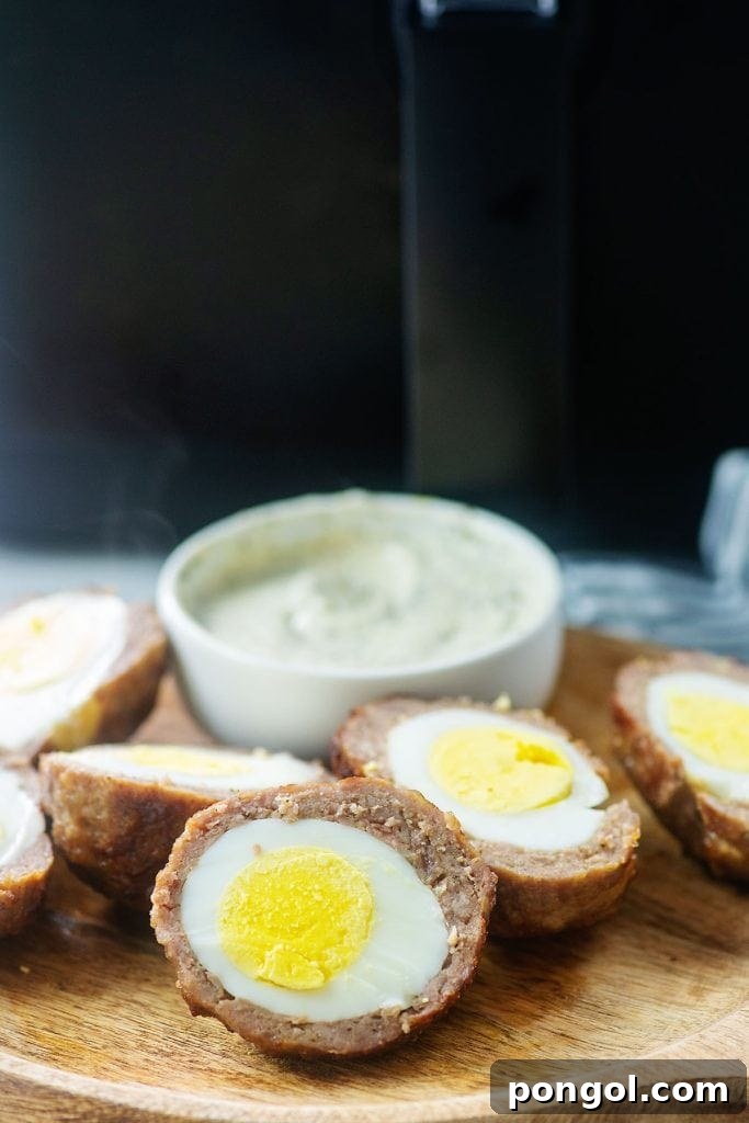 30 Delicious Keto Air Fryer Recipes 26 Scotch eggs on a cutting board