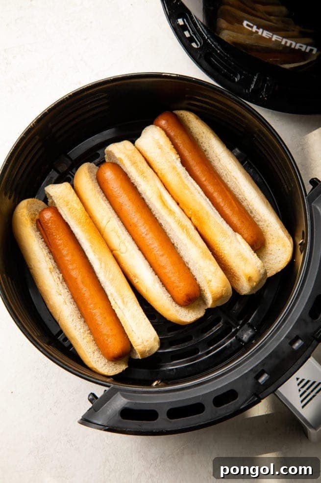 30 Delicious Keto Air Fryer Recipes 9 3 Hot dogs in buns in an air fryer basket