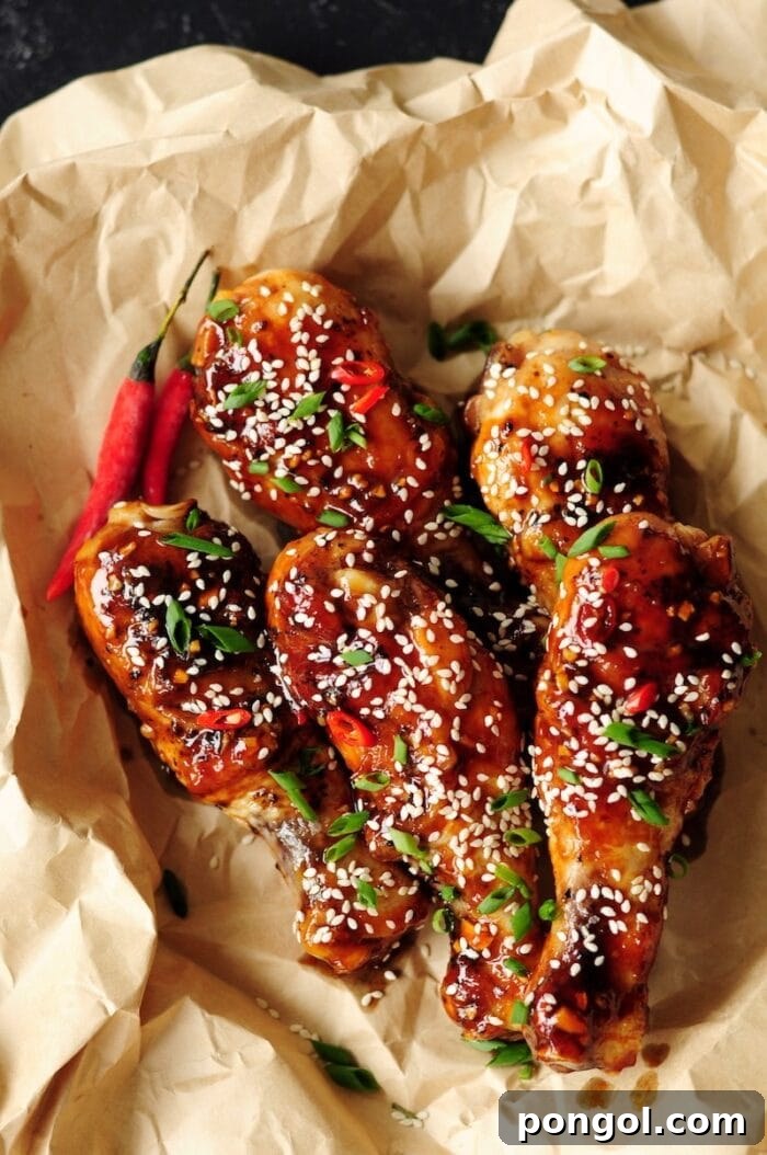 Marinated sous vide sticky chicken drumsticks arranged appetizingly in a paper-lined basket