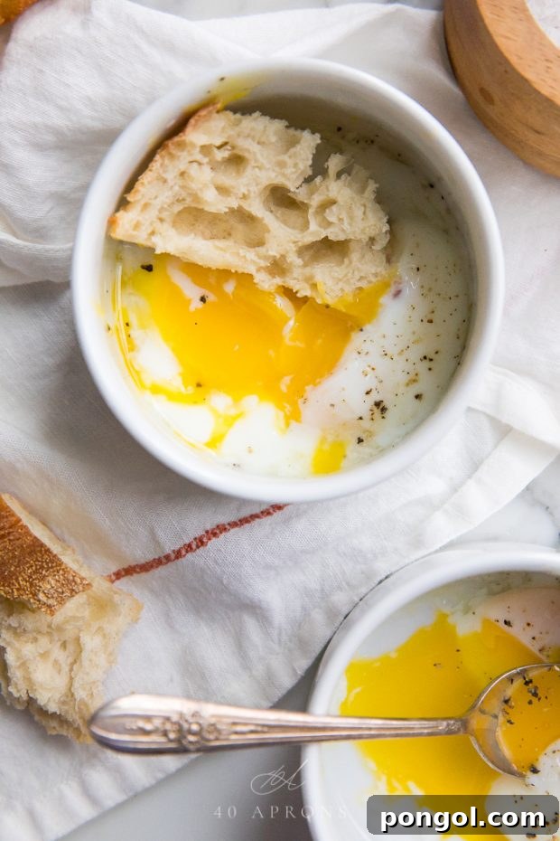 Sous vide soft eggs nestled in ramekins, showcasing their delicate texture and golden yolks