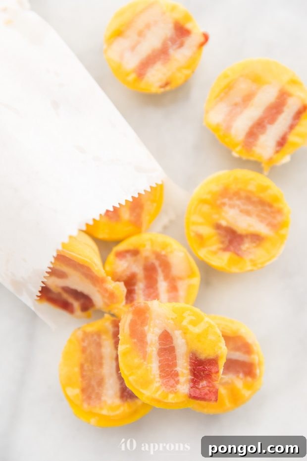 Five sous vide egg cups tumbling out of a paper bag onto a pristine marble counter, highlighting their appealing form