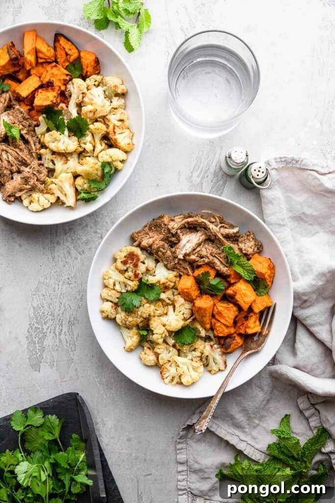 Bowls of tahini chicken on a light countertop