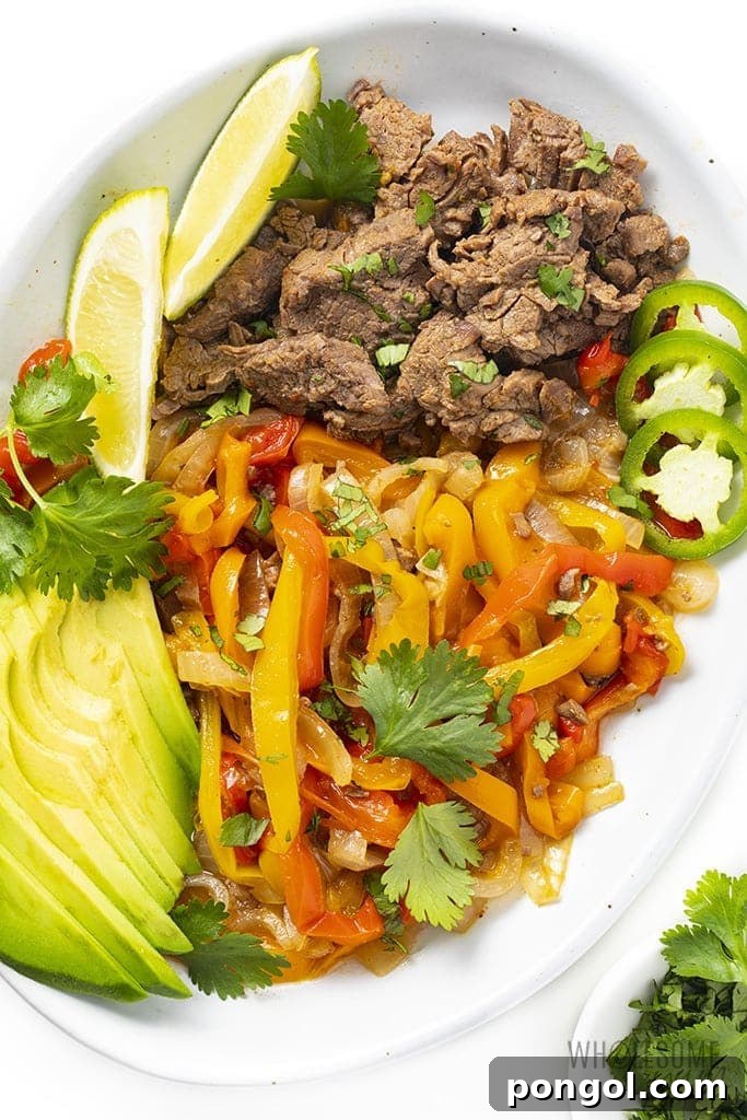 Instant pot steak fajita tray with steak, peppers, and avocado
