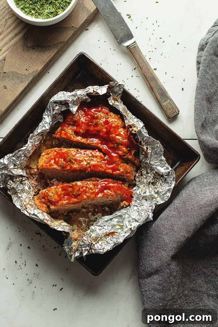 3 slices of meatloaf on aluminum foil