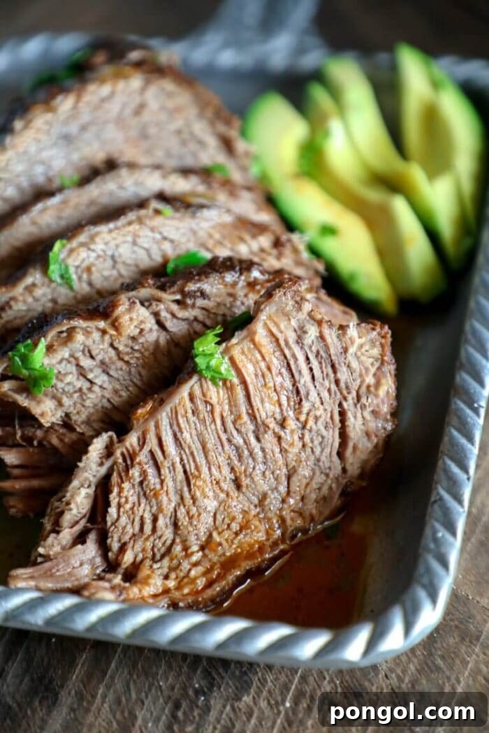 Close up of beef brisket on a metal pan