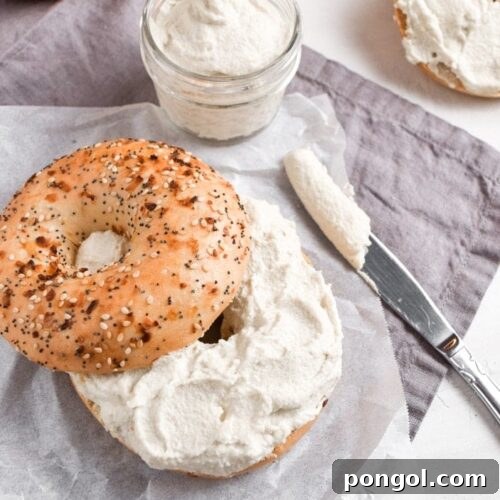 Creamy vegan cream cheese in a small dish with crackers.