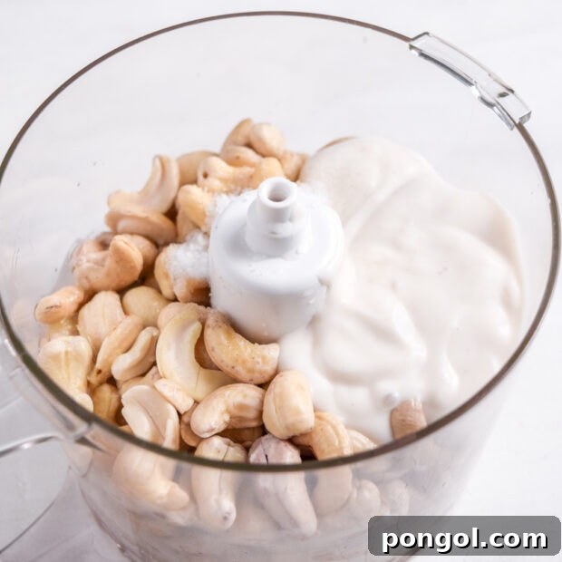 Ingredients for vegan cream cheese in a food processor.