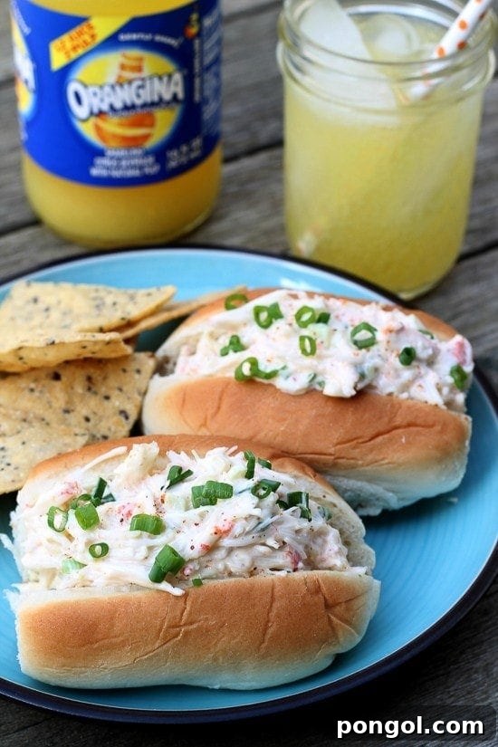 Sriracha crab rolls on a vibrant blue plate, showcasing fresh ingredients and a spicy kick.