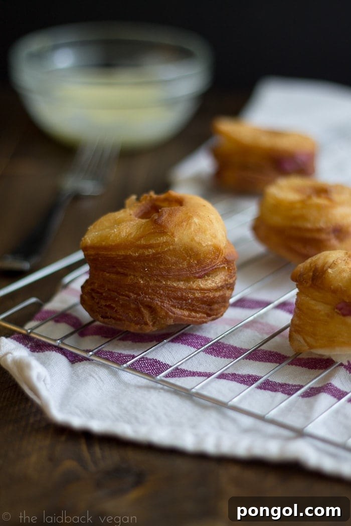 Pillowy Vegan Flaky Doughnuts with Blackberry Cream Cheese and Zesty Lemon Glaze 4 Close-up detail of the flaky layers in a Vegan Flaky Donut.